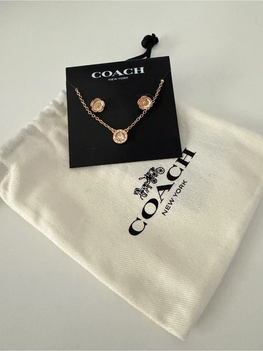 Coach necklace matching